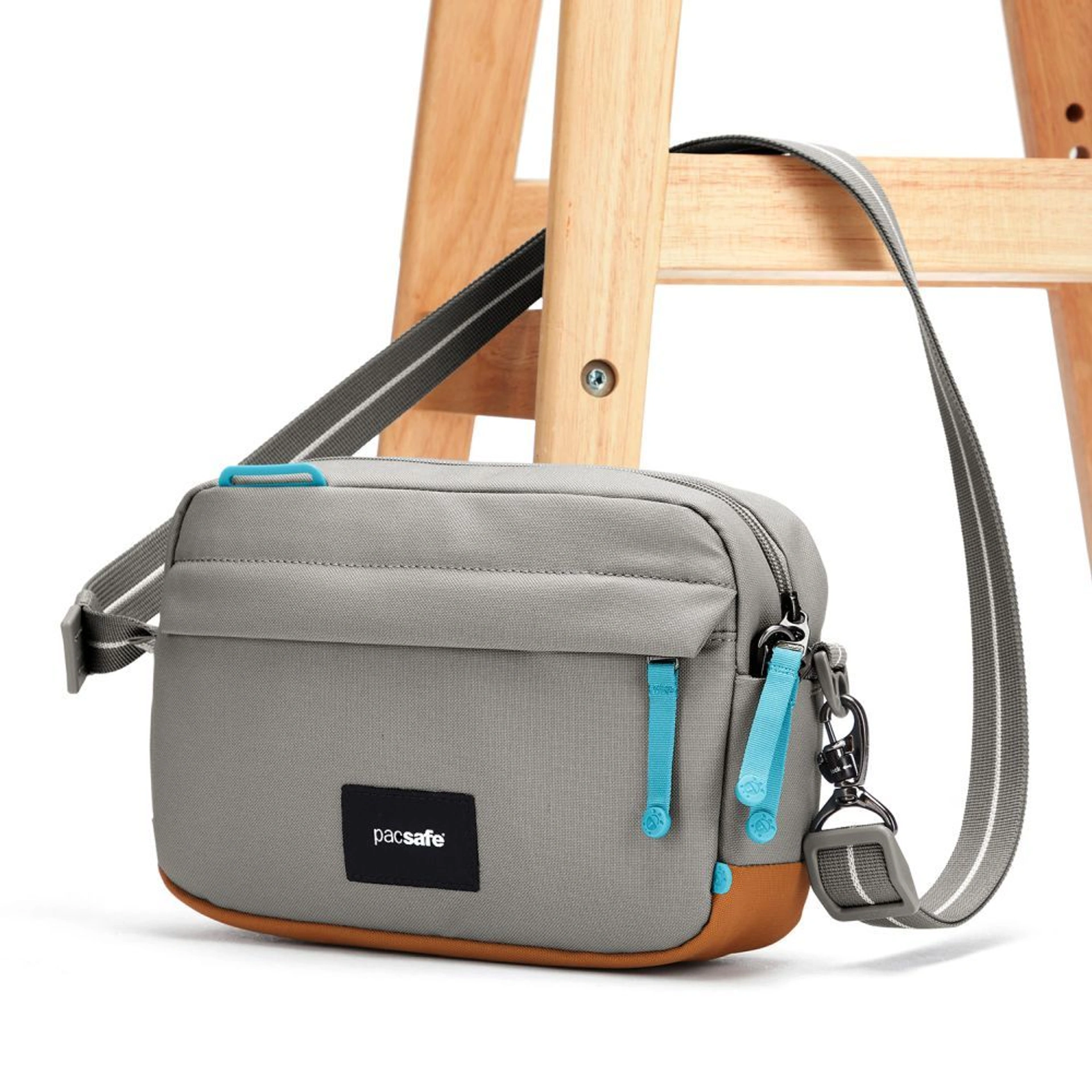 Сумка через плече антизлодій Pacsafe GO Crossbody - Сірий / помаранчевий