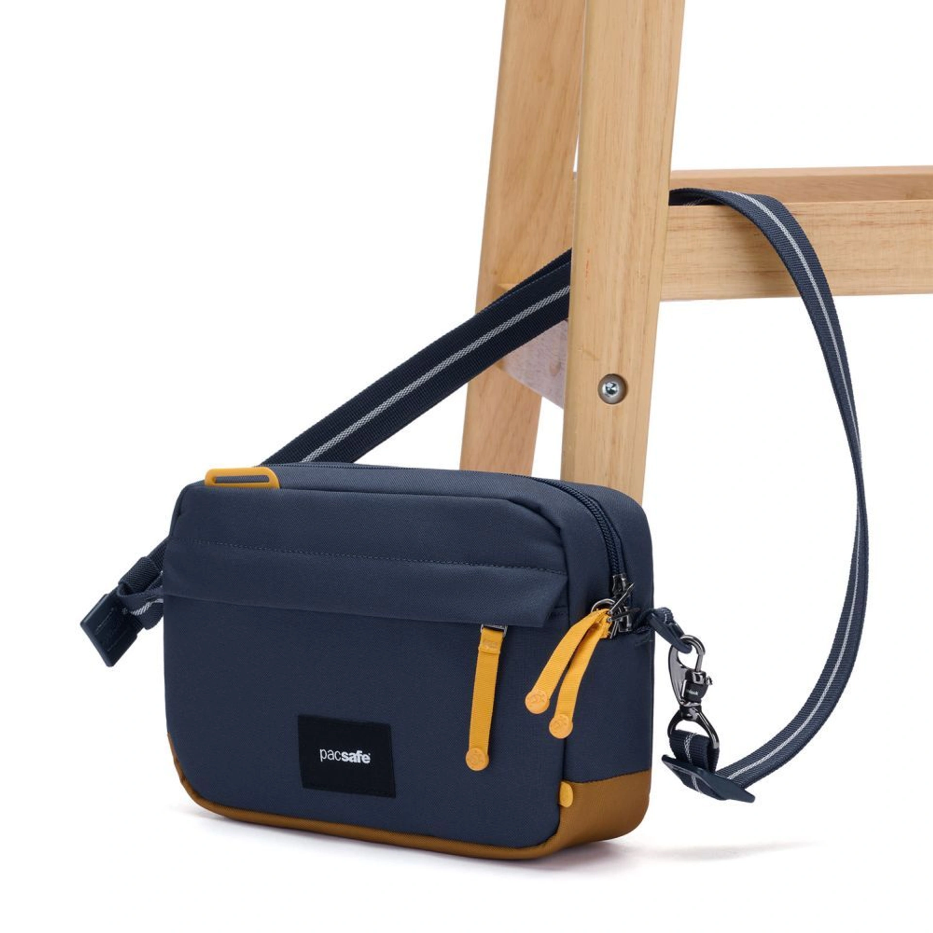 Сумка через плече антизлодій Pacsafe GO Crossbody - Темно-синій / помаранчевий